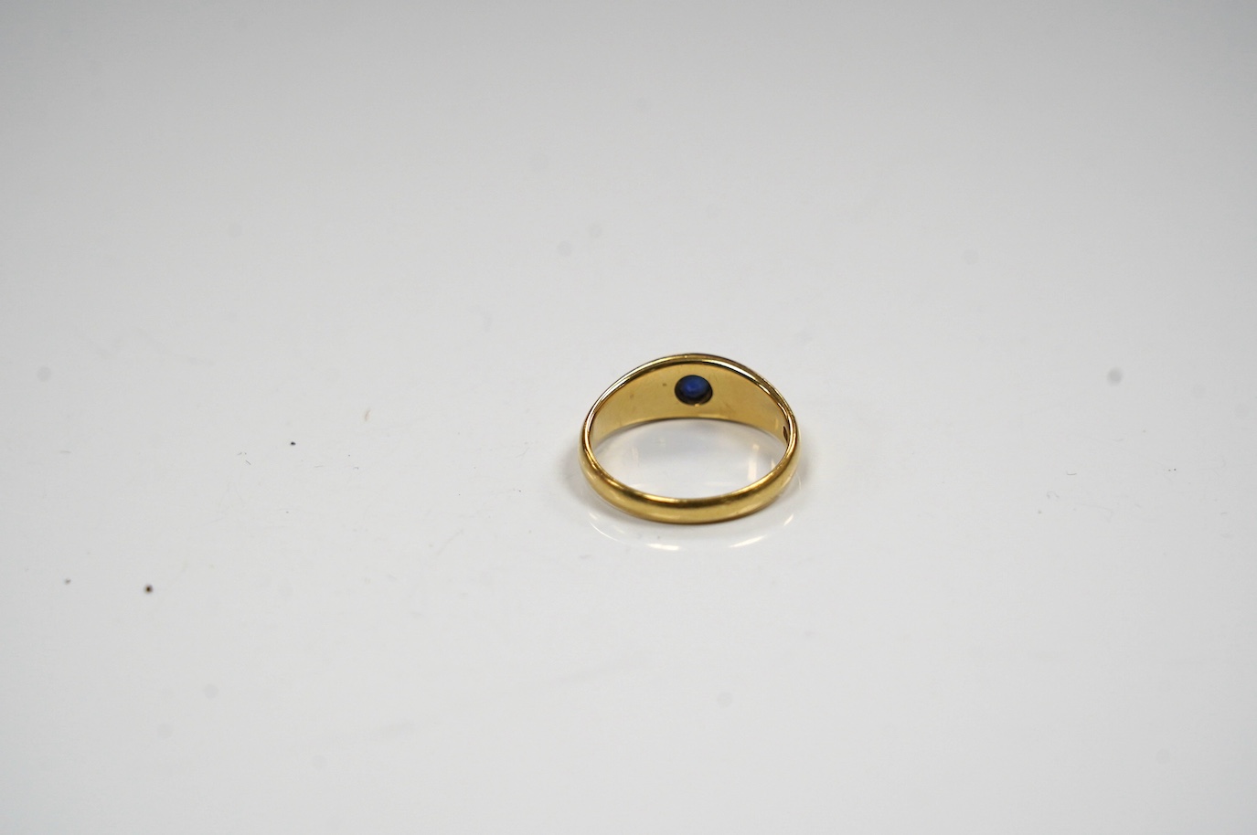 An early to mid 20th century 18ct and gypsy set single stone sapphire and two stone split pearl set ring, size O, gross weight 4.7grams. Condition - poor to fair